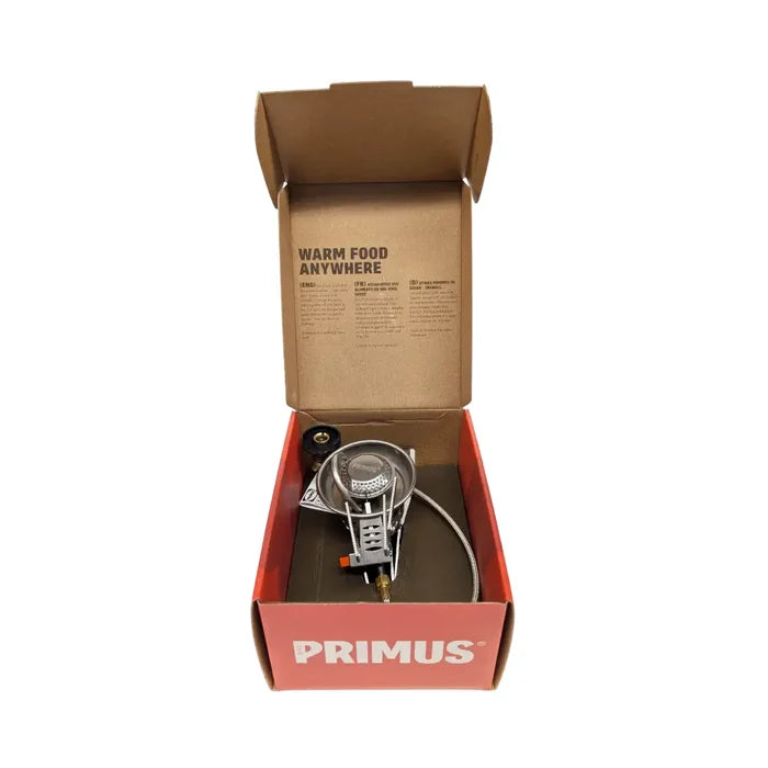 Primus Easy Fuel Duo camping stove in its opened cardboard packaging on a white background