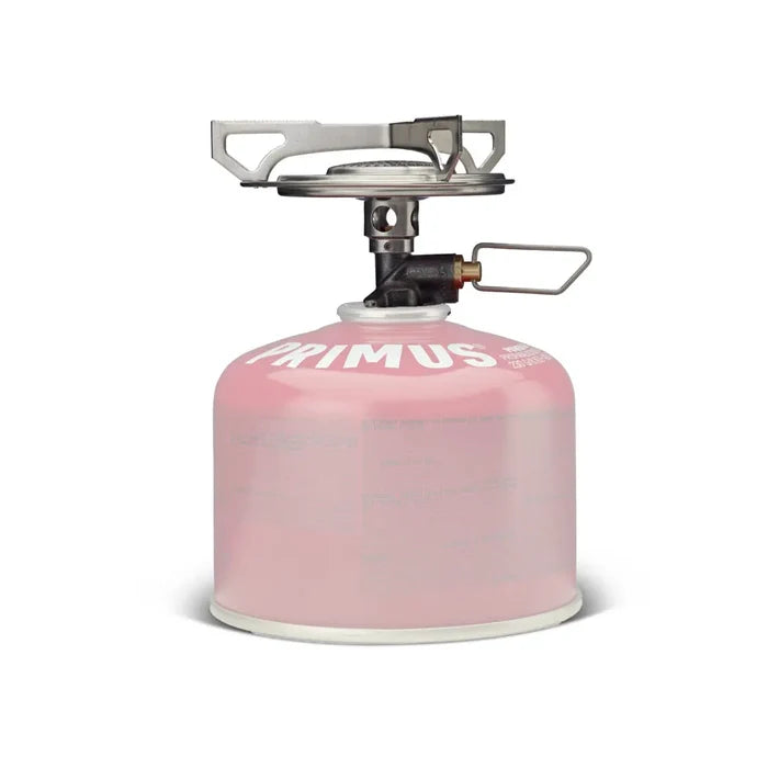Primus Essential Trail Camping Gas Stove ontop of a POwer gas canister that is whited out