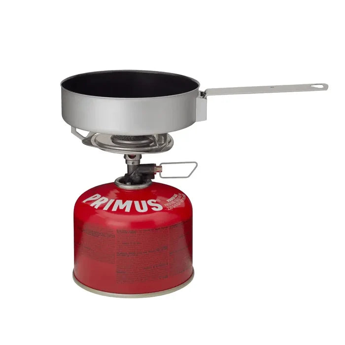 Primus Essential Trail Kit stove and 230g Power gas canister with the frying pan sitting on top