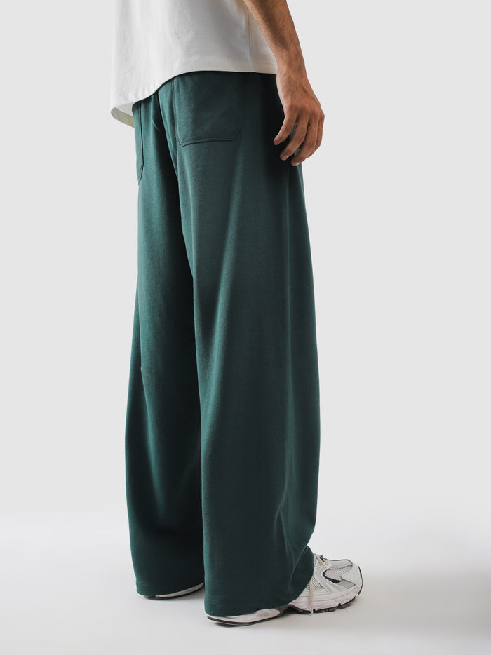Side seam pocket on green terry sweatpants - GROOVY Pakistan