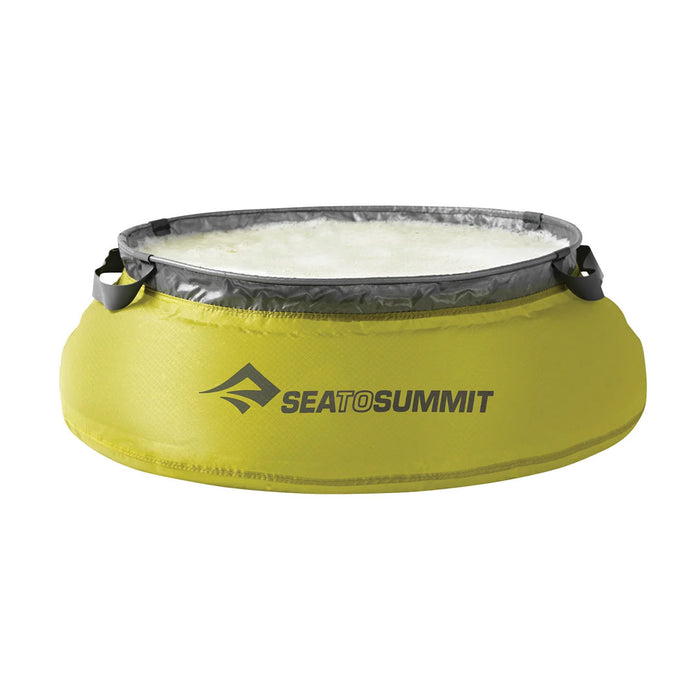 Front detail of a Sea To Summit Ultra-Sil collapsible fabric kitchen sink filled with water
