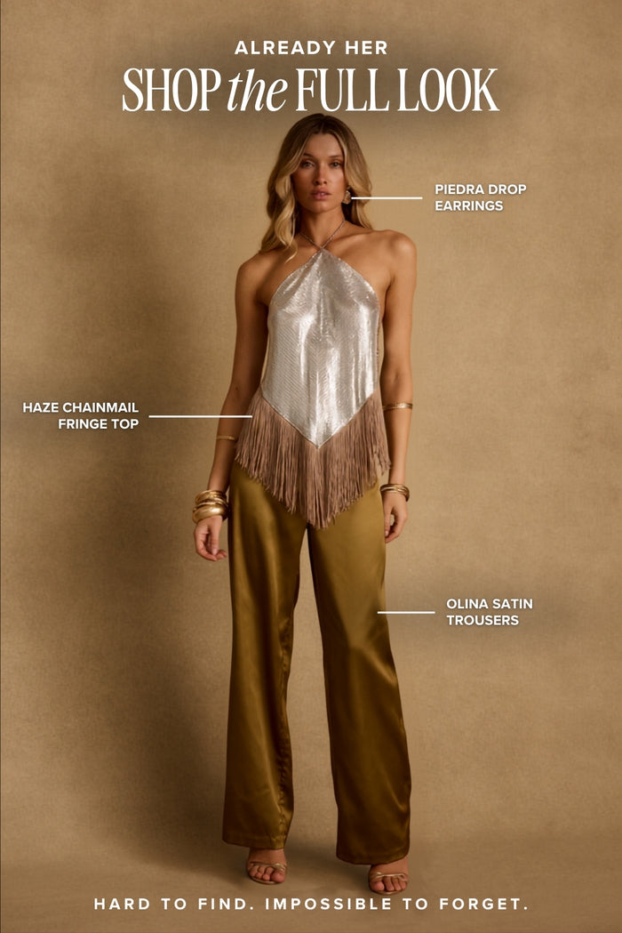 Already Her look labeled Haze chainmail fringe top, Olina satin trousers, Piedra drop earrings.
