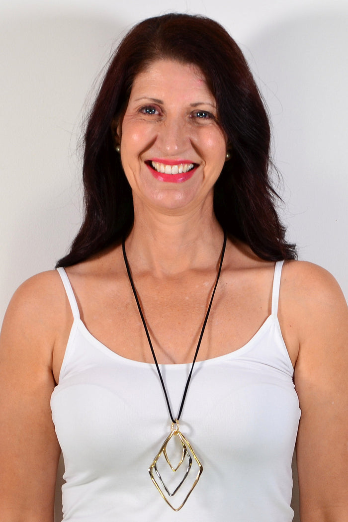 Silver and gold three-level pendant necklace featuring triangle-shaped charms, from I Love Tunics.