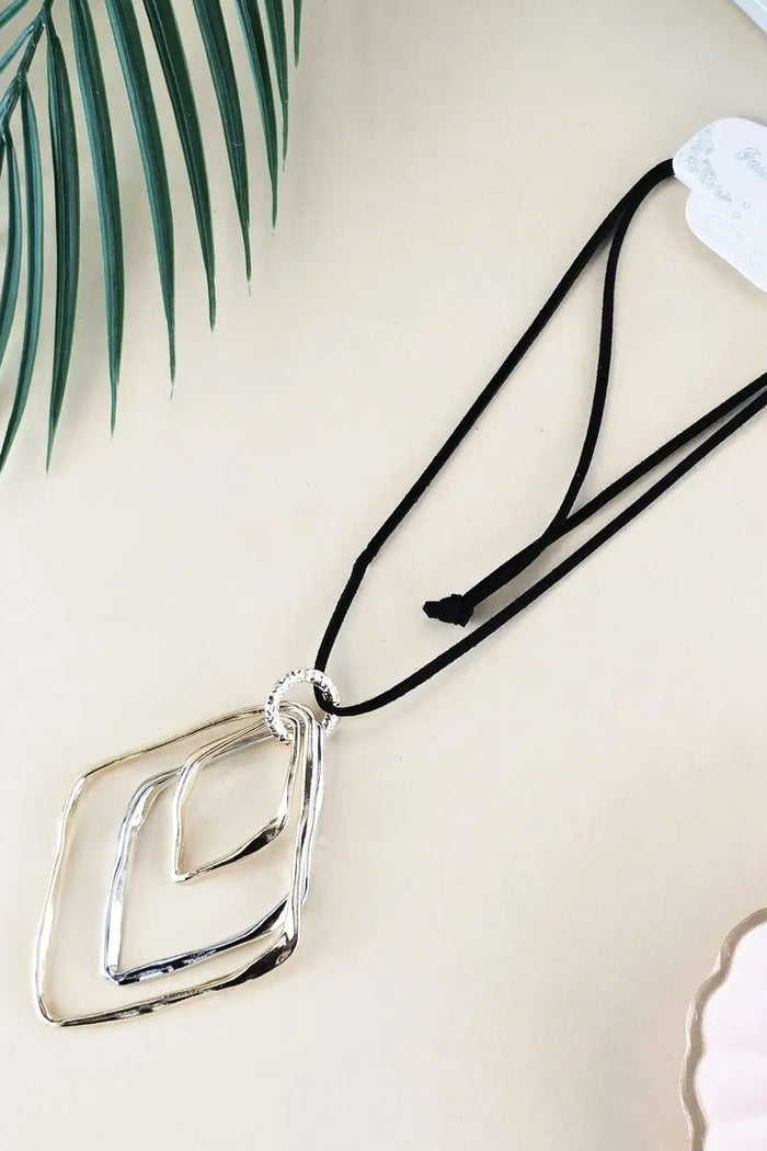 Silver and gold three-level pendant necklace by I Love Tunics with layered chain design and elegant pendant details.