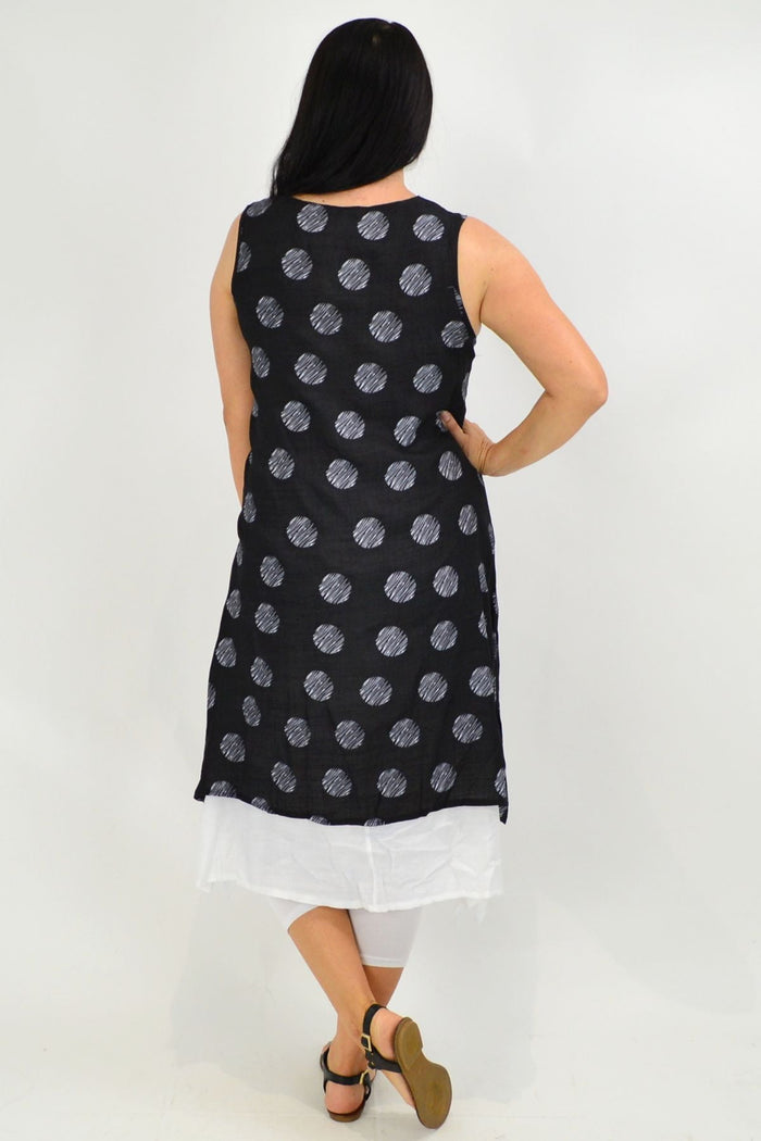 Black sleeveless tunic dress with white dot overlay from La Mode, stylish and casual, shown on a model.