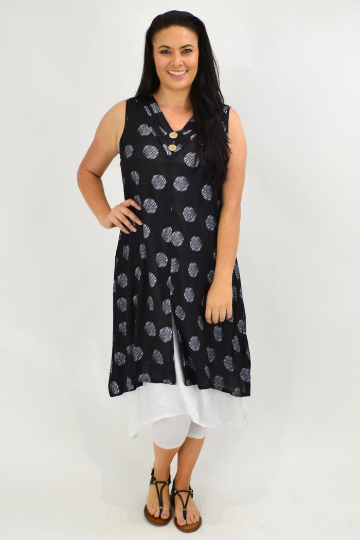 Black sleeveless tunic dress with white dot overlay from La Mode, featuring a relaxed fit and stylish design.