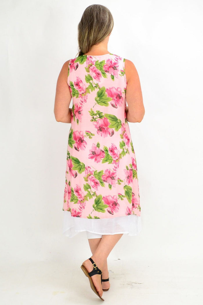 Pink summer garden tunic dress by La Mode, featuring lightweight fabric and floral pattern, displayed on a hanger.