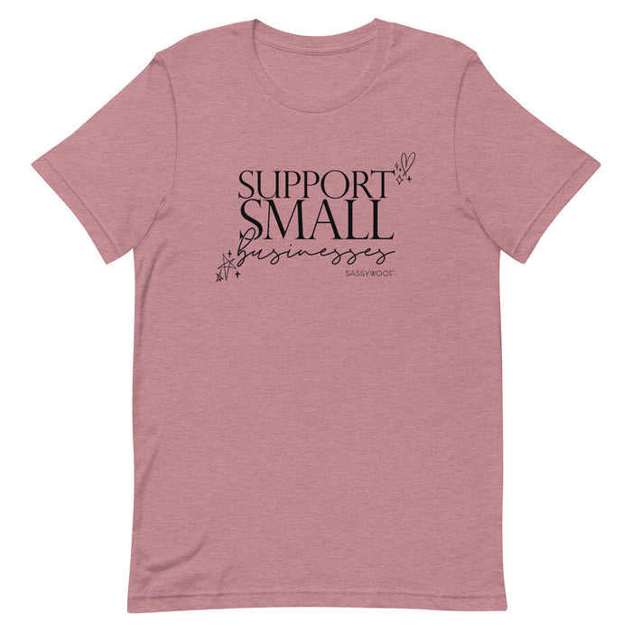 The Sassy Woof Support Small Businesses Tee is a comfy unisex mauve shirt featuring black cursive and bold "SUPPORT SMALL businesses" text, accented with stars and hearts.