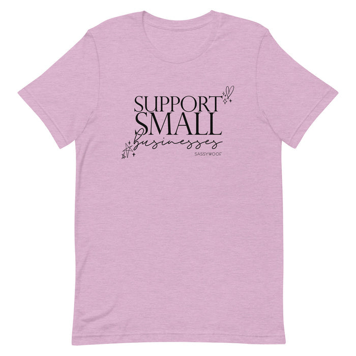 The Sassy Woof Support Small Businesses Tee is a comfy light purple unisex shirt featuring "SUPPORT SMALL businesses" in bold black text with star and heart doodles—perfect for everyday wear.