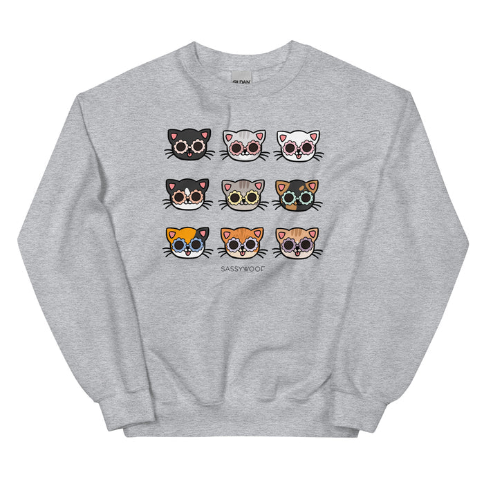 The Sassy Woof Sweatshirt - Cats features nine cartoon felines with unique fur and glasses above the Sassy Woof logo—making this comfy unisex crewneck a purrfect pick for cat lovers.