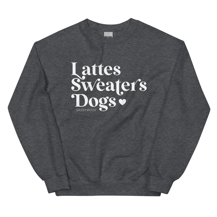 The Sweatshirt - Lattes, Sweaters, Dogs by Sassy Woof is a cozy unisex dark gray crewneck featuring a bold “Lattes Sweaters Dogs ♥ Sassy Woof” print—perfect for fall and dog lovers.