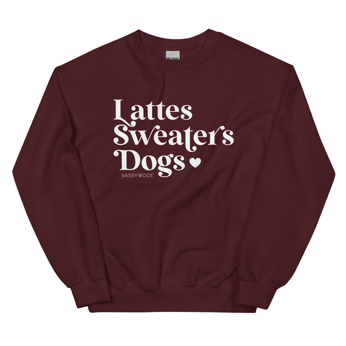 The Sweatshirt - Lattes, Sweaters, Dogs by Sassy Woof is a maroon unisex crewneck with white "Lattes Sweaters Dogs" text and a small heart—Sassy Woof below. Perfect cozy attire for your fall activities!.