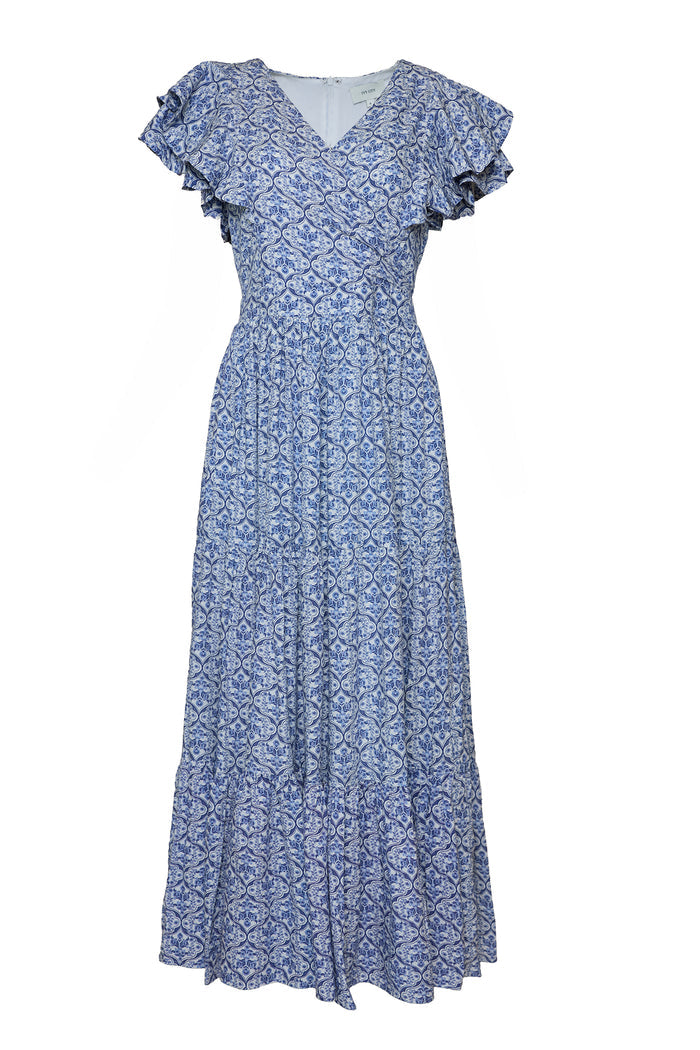 The Trixie Dress in Blue Moroccan Tile by Ivy City Co is a cotton maxi dress with short ruffled sleeves, V-neckline, fitted waist, and a flowing tiered skirt, featuring an intricate blue and white geometric print.