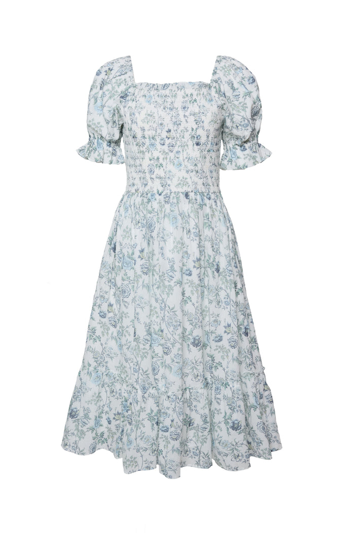 The Valencia Dress in Ivory Climbing Vine Bloom by Ivy City Co features a light blue and ivory floral print, puffed short sleeves, square neckline, smocked bodice, and a flared tiered skirt—an effortlessly stylish maternity-friendly choice.