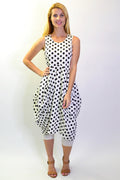 Cordelia St Vivian black and white spotted tunic dress with long sleeves and a relaxed fit, displayed on a hanger.