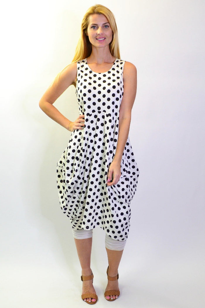 Cordelia St Vivian black and white spotted tunic dress with long sleeves and a relaxed fit, displayed on a hanger.
