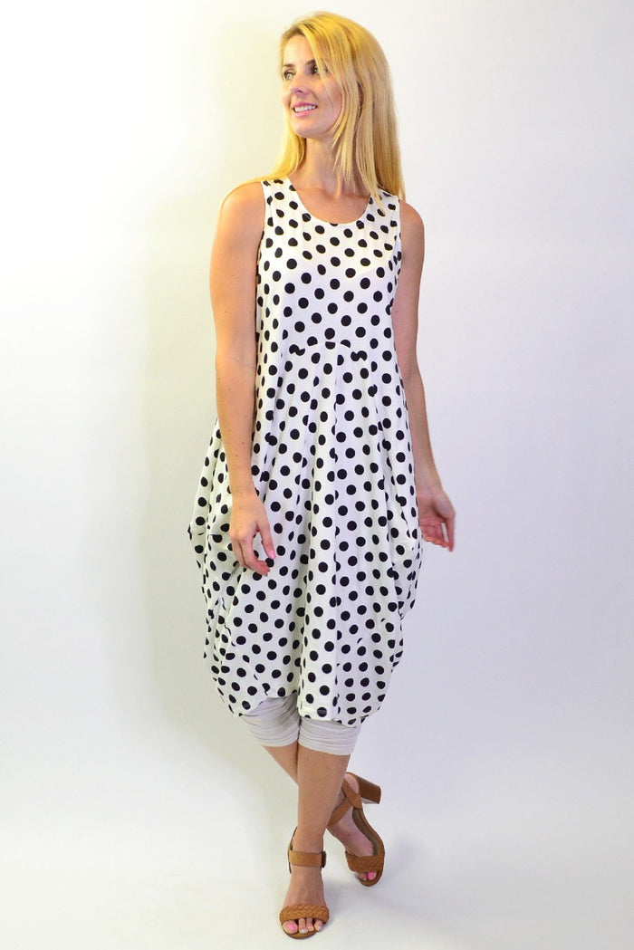 Vivian black and white spot tunic dress by Cordelia St featuring a loose fit and long sleeves, displayed on a hanger.