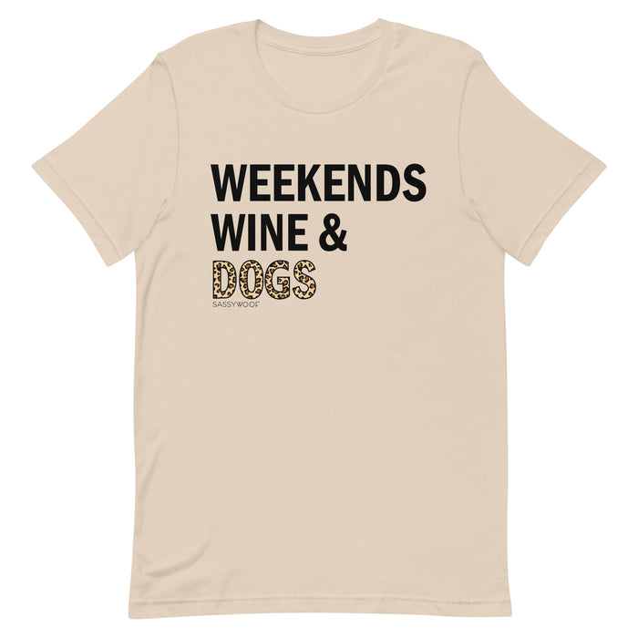 The Weekends, Wine, & Dogs Tee by Sassy Woof features bold "WEEKENDS WINE & DOGS" leopard print text with "SASSYWOOF" below on 100% ring-spun cotton—perfect for unisex comfy weekend style.