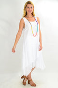 White asymmetrical hem tunic dress by Missy Q, loose summer style with flowing fabric and casual fit.