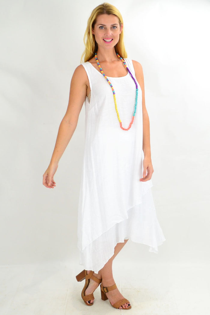 White asymmetrical hem tunic dress by Missy Q, loose summer style with flowing fabric and casual fit.