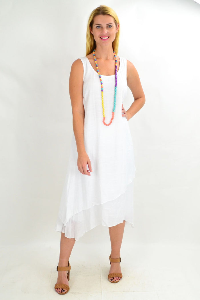 White asymmetrical hem tunic dress by Missy Q, loose summer style with flowing fabric and relaxed fit.