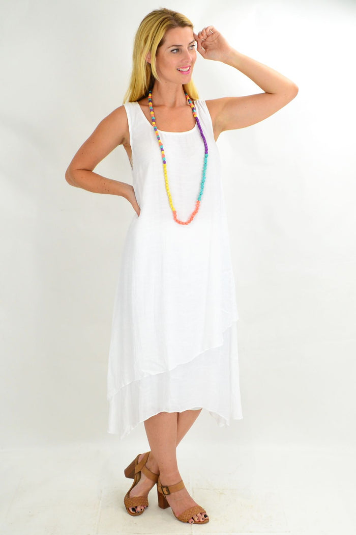 White asymmetrical hem tunic dress by Missy Q, loose fit with flowing fabric, perfect for summer wear.
